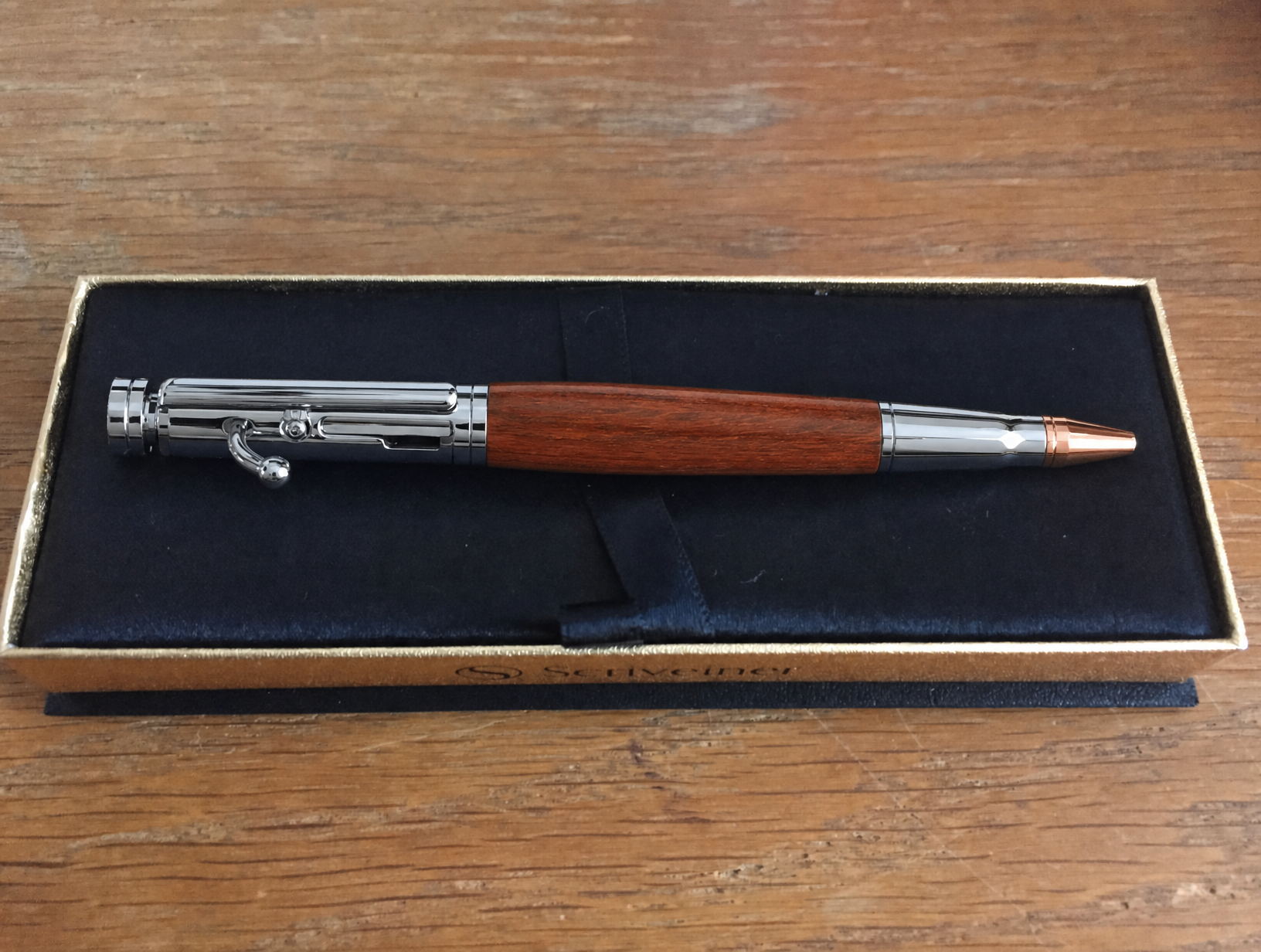 Wood and silver pen displayed in a gift box