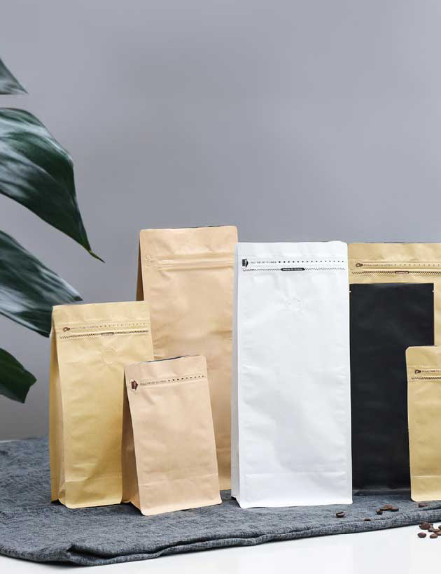 Some kraft paper bags on the table, coffee bags