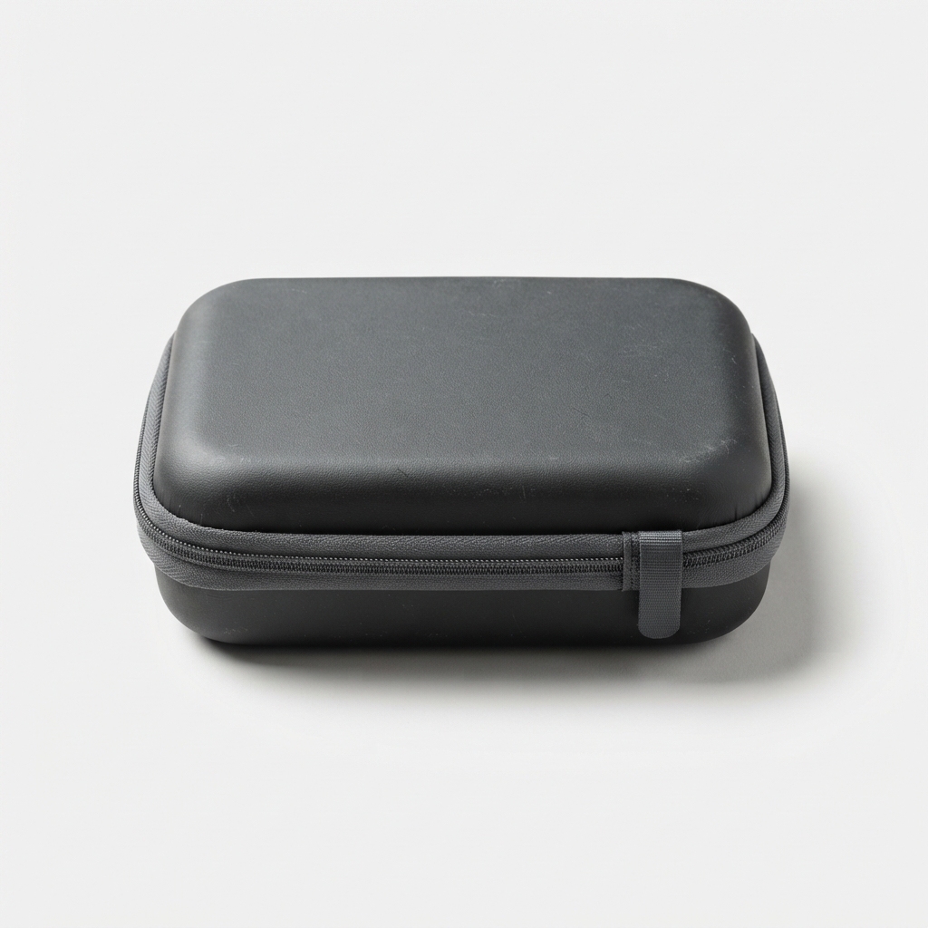 Dark gray hard travel case for AI voice translator on matte off-white background