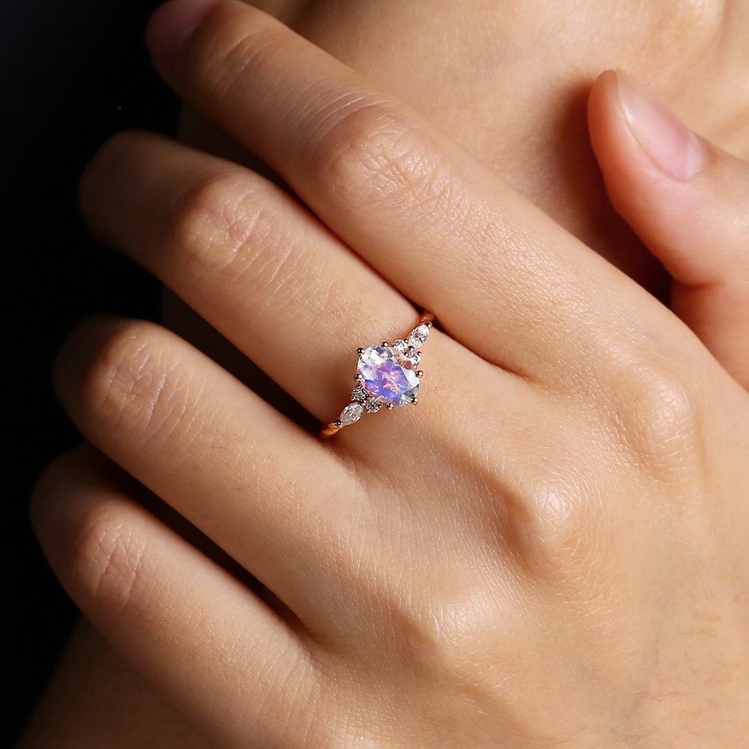 Juyoyo Oval Cut Rainbow Moonstone Twisted Ring with Diamond Accents for Women