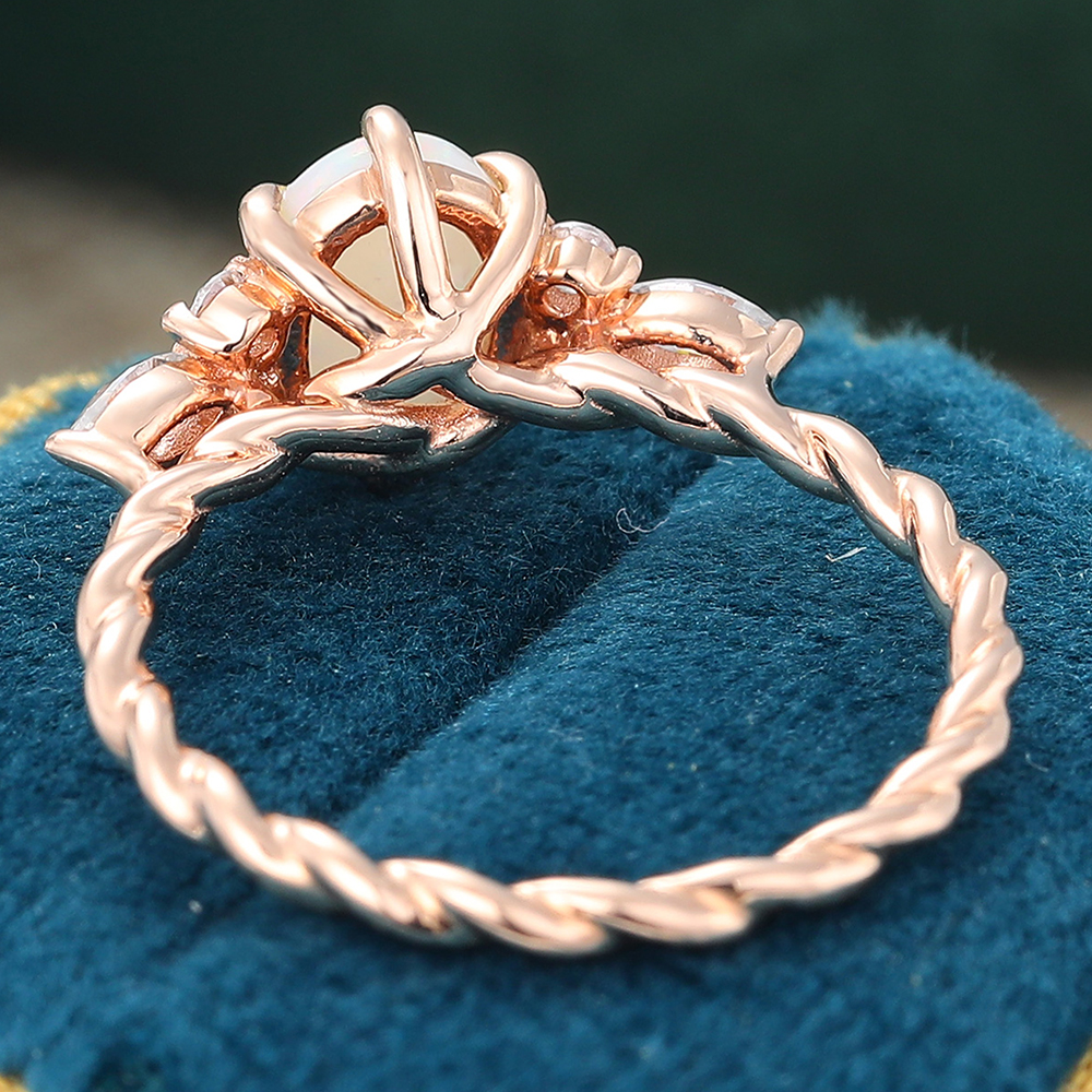 Juyoyo oval cut opal rose gold twisted engagement ring