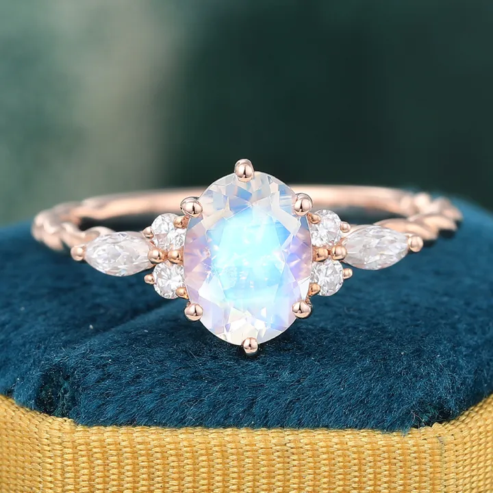 Juyoyo Oval Cut Rainbow Moonstone Twisted Ring with Diamond Accents for Women