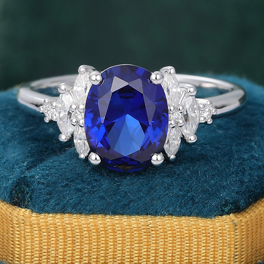 Oval Cut Lab Grown Sapphire Engagement Ring with Side Stone