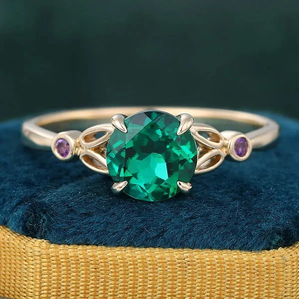 emerald three stone engagement ring