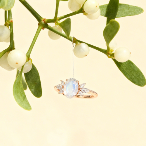 Oval Cut Moonstone and Diamond Side Stone Engagement Ring