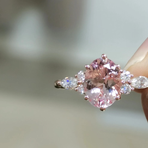 Twisted Oval Cut Morganite Side Stone Engagement Ring with Diamond Accents