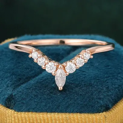 silver curved moissanite wedding band