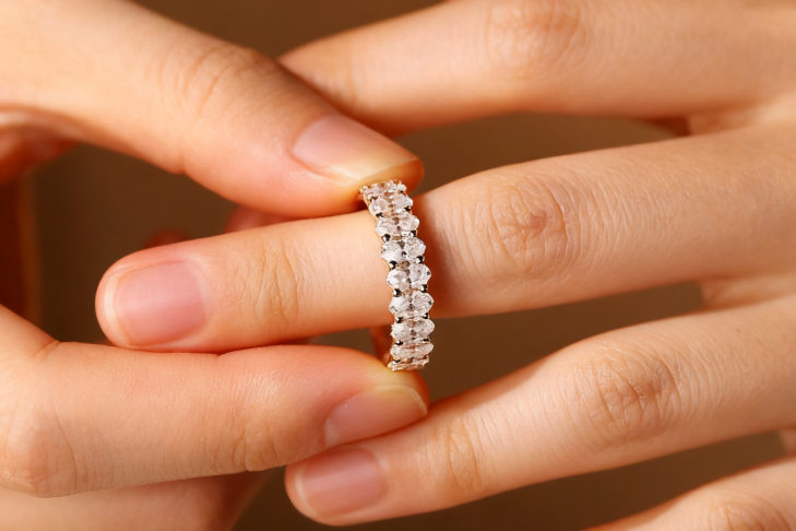 wearing ring in the middle finger