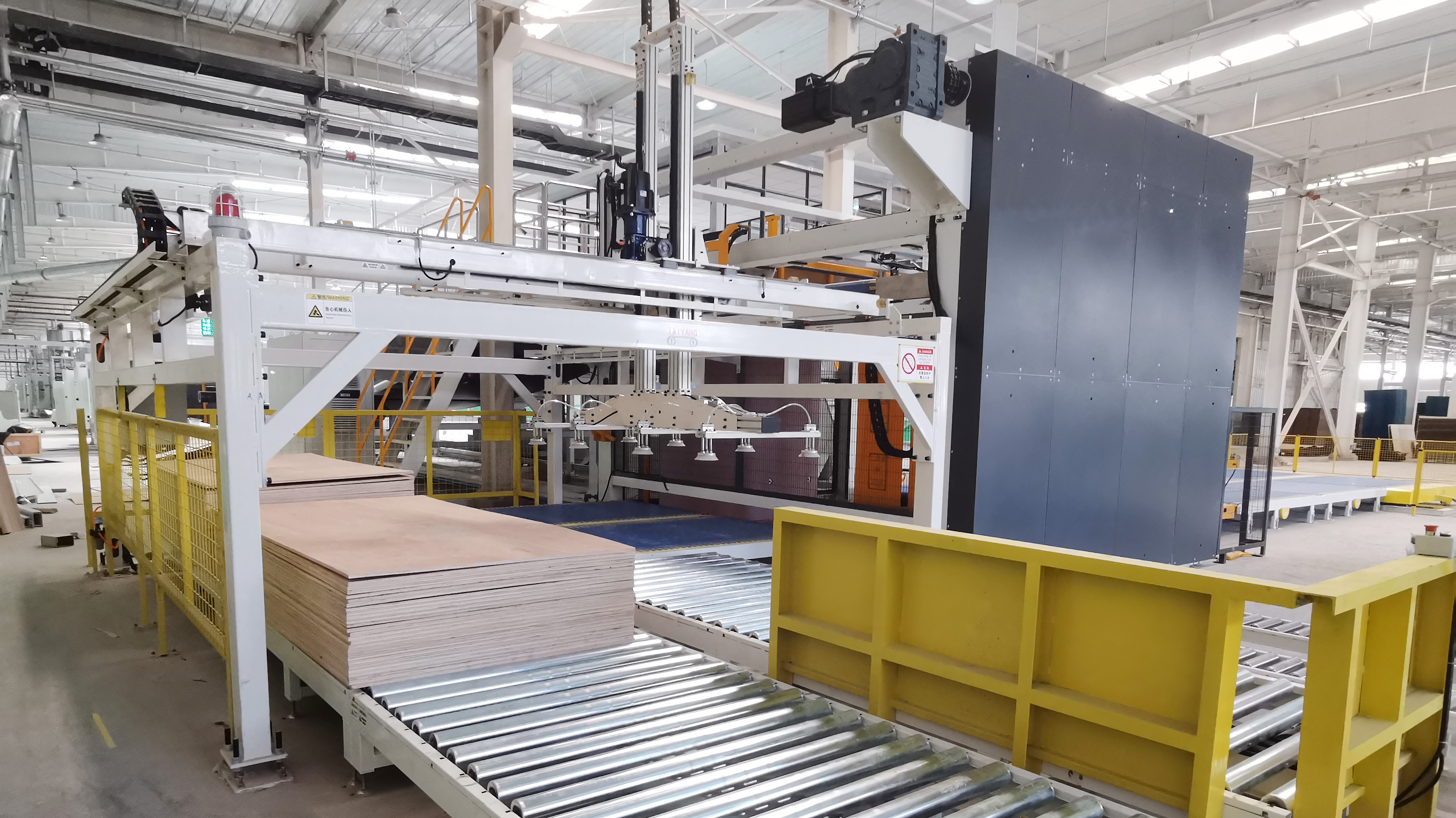 Automatic pad delivery system with robotic arm