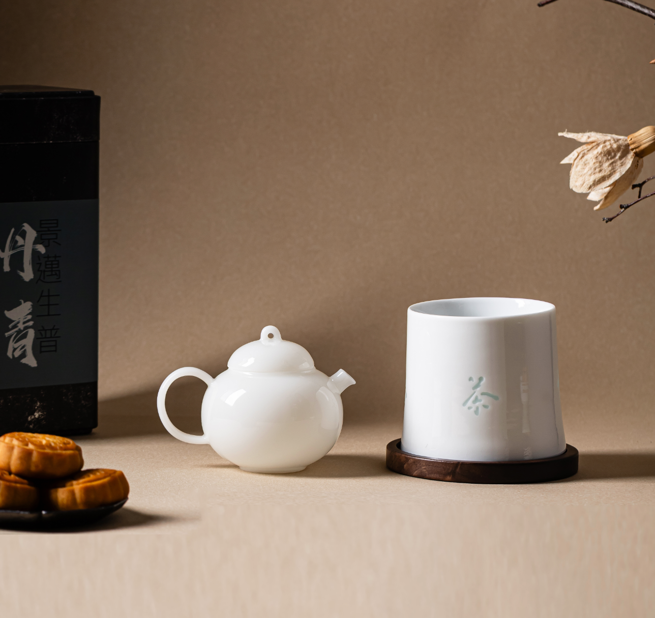 TeaTsy tea set, mooncakes and a Jingmai sheng puer tin on a Mid-Autumn table