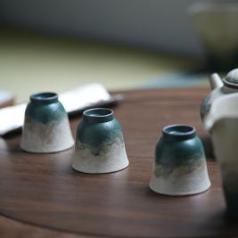 Lake Veil tea cup group shot showing blue-green kiln-change glaze variation