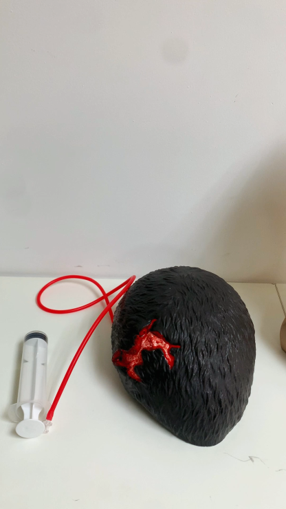 Wearable Scalp Wound Moulage with Bleeding Simulation