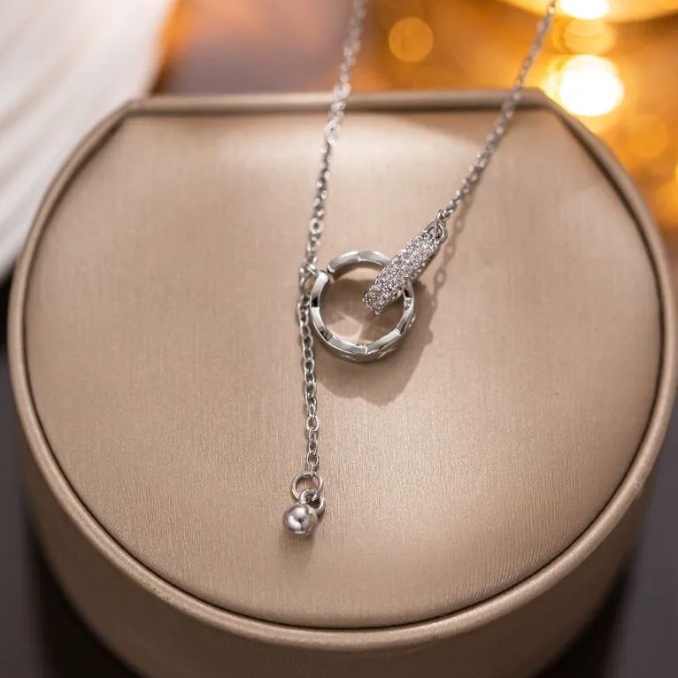 “Linked in Time” – Interlocked Double Ring Tassel Necklace