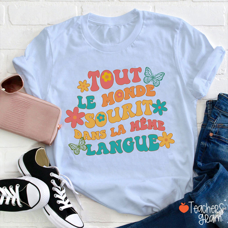 Tout Le Monde Sourit Dans La Même Langue French Teacher T-Shirt