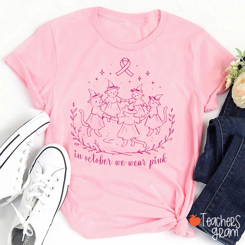 Cute Cat Witch In October We Wear Pink Nurse T‑Shirt