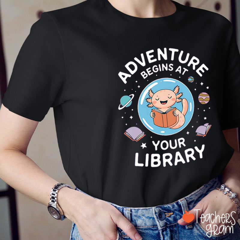 Adventure Begins At Your Library Teacher T-Shirt