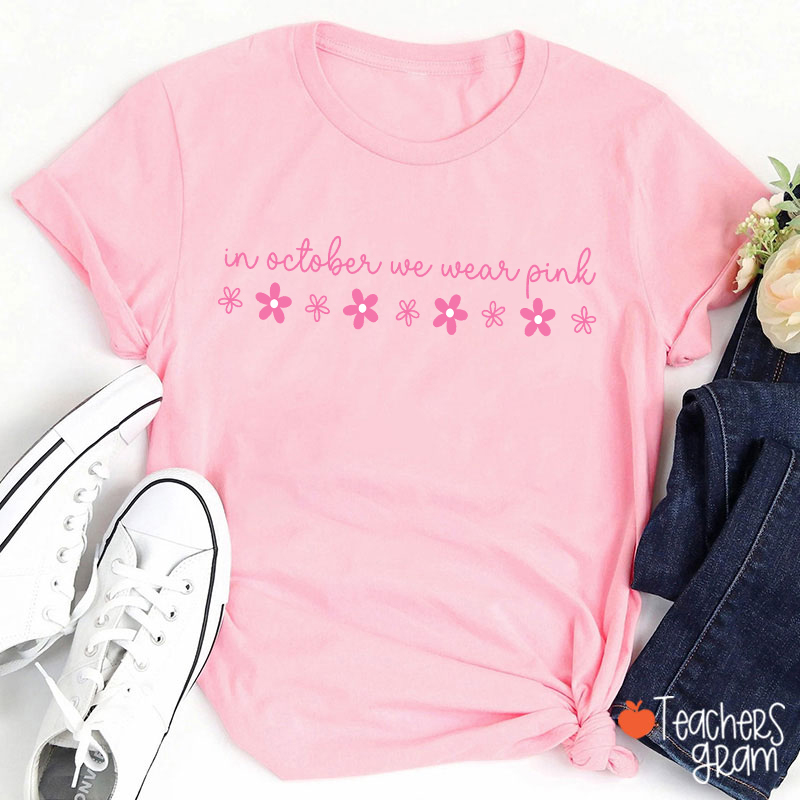 In October We Wear Pink Handwritten Script Daisy Floral Fall Teacher T-Shirt
