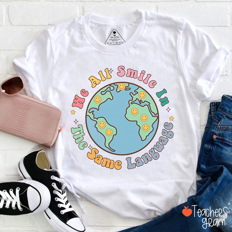 We All Smile In The Same Language Teacher T-Shirt