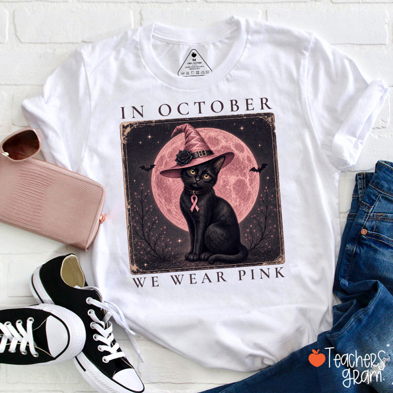 In October We Wear Pink Witch Black Cat Pink Moon Breast Cancer Awareness Teacher T‑Shirt