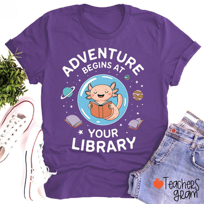 Adventure Begins At Your Library Teacher T-Shirt