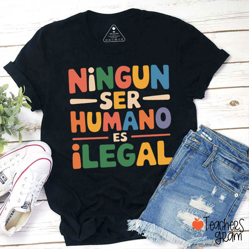 Ningun Ser Humano Es Ilegal Teacher T-Shirt