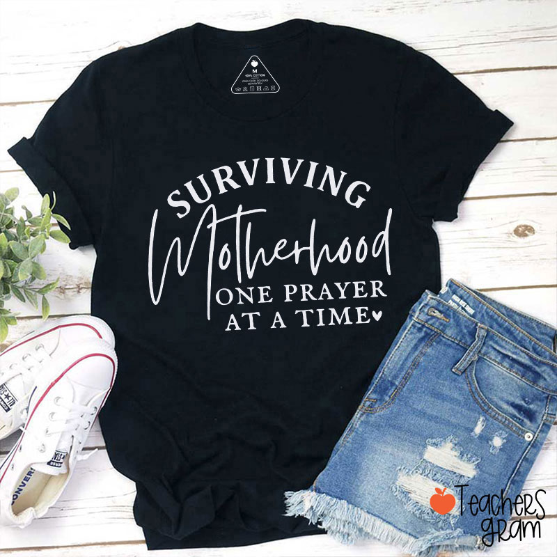 Surviving Motherhood One Prayer At A Time Teacher T-Shirt