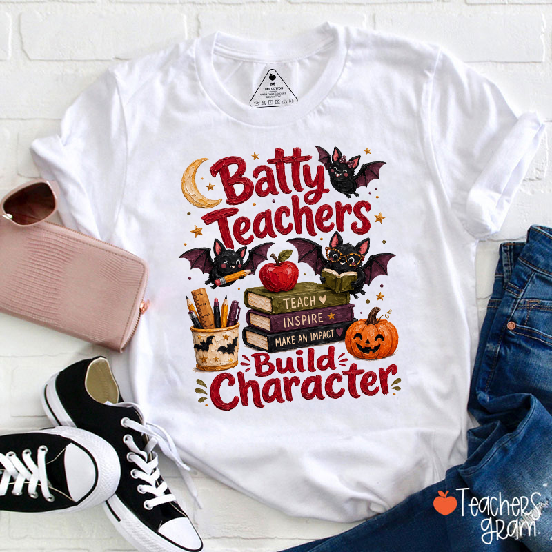 Batty Teachers Build Character Bat Book Pumpkin Halloween Teacher T‑Shirt