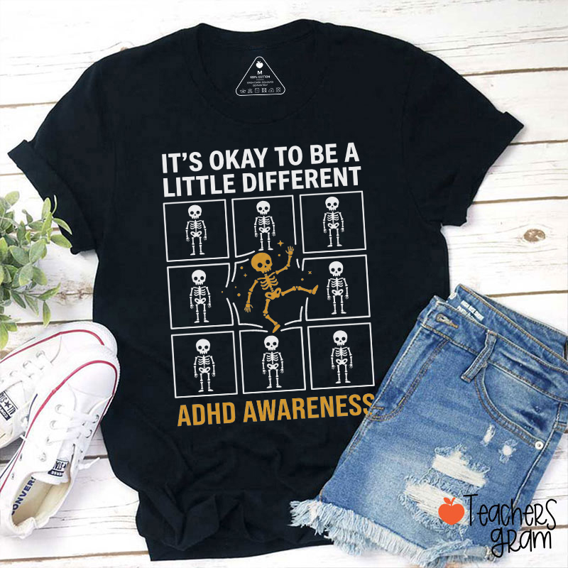 It’s Okay To Be A Little Different ADHD Awareness Skeleton Teacher T‑Shirt