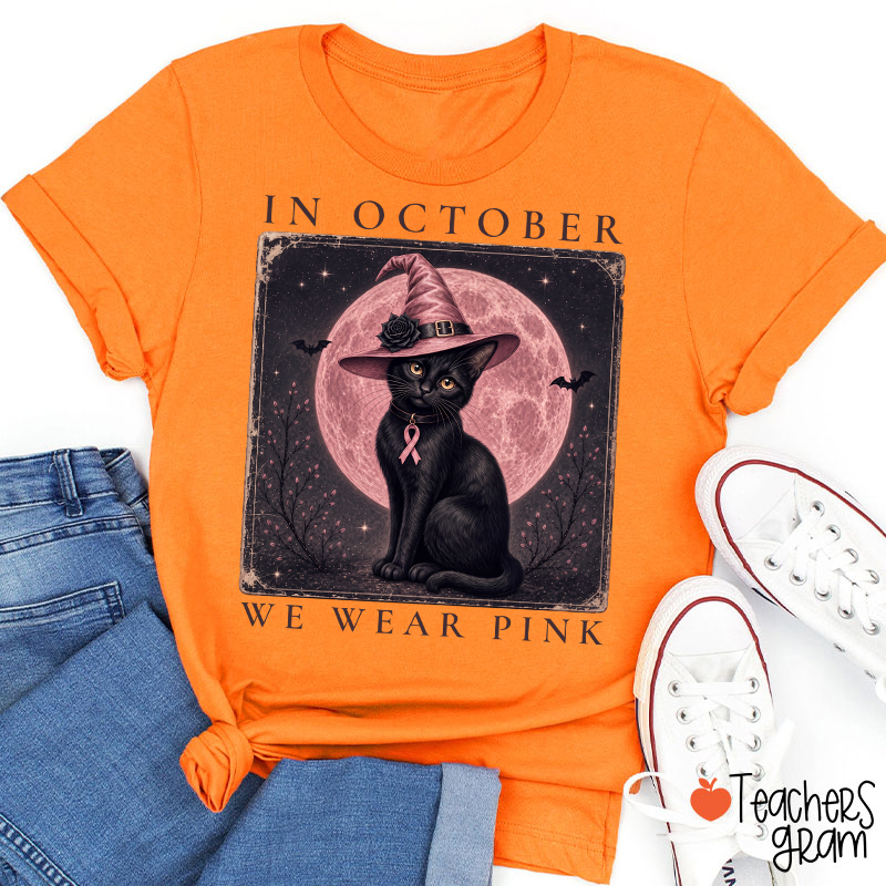 In October We Wear Pink Witch Black Cat Pink Moon Breast Cancer Awareness Teacher T‑Shirt
