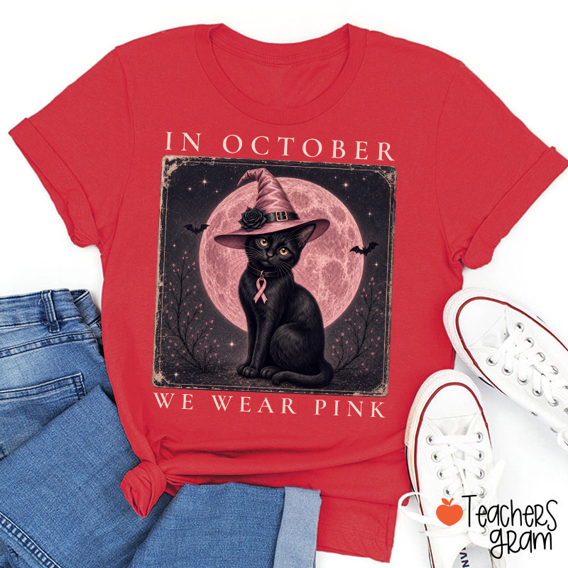 In October We Wear Pink Witch Black Cat Pink Moon Breast Cancer Awareness Teacher T‑Shirt