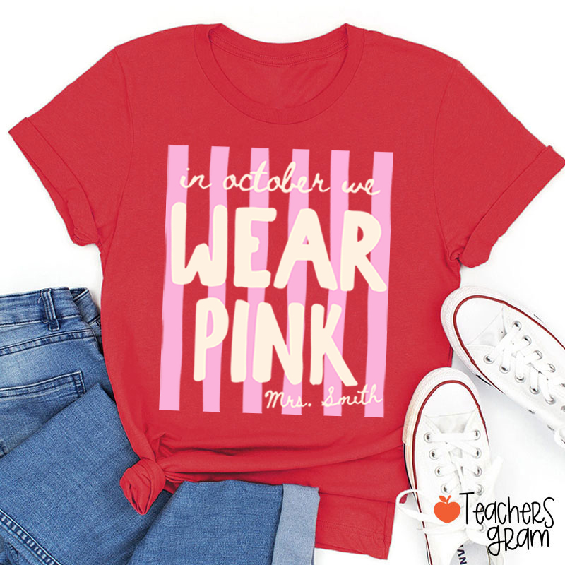 Personalized Name In October We Wear Pink Striped Teacher T-Shirt