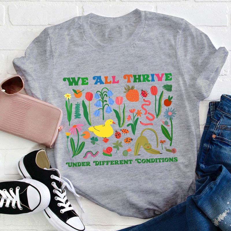 We All Thrive Under Different Conditions Teacher T-Shirt