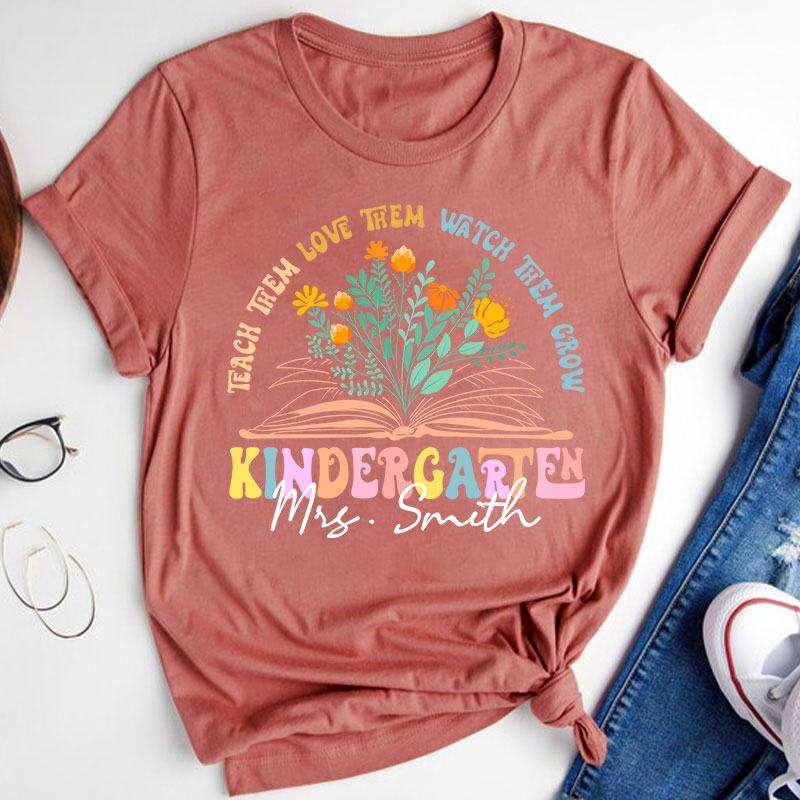 Personalized Book And Flower Teach Them Love Them Watch Them Grow Teacher T-Shirt