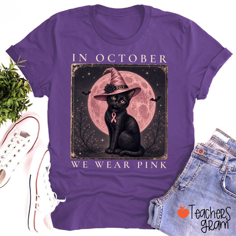 In October We Wear Pink Witch Black Cat Pink Moon Breast Cancer Awareness Teacher T‑Shirt