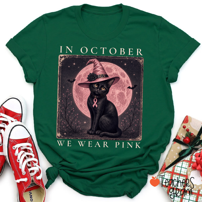 In October We Wear Pink Witch Black Cat Pink Moon Breast Cancer Awareness Teacher T‑Shirt