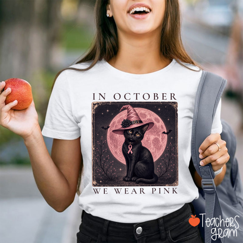 In October We Wear Pink Witch Black Cat Pink Moon Breast Cancer Awareness Teacher T‑Shirt