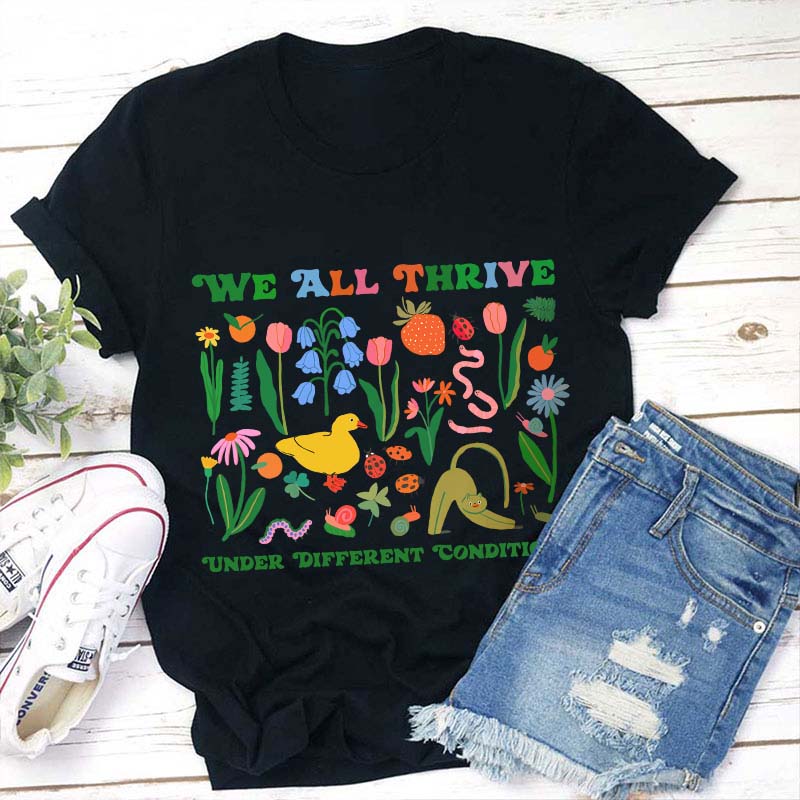 We All Thrive Under Different Conditions Teacher T-Shirt