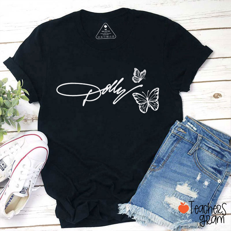 Dolly Signature Butterfly Graphic Teacher T‑Shirt