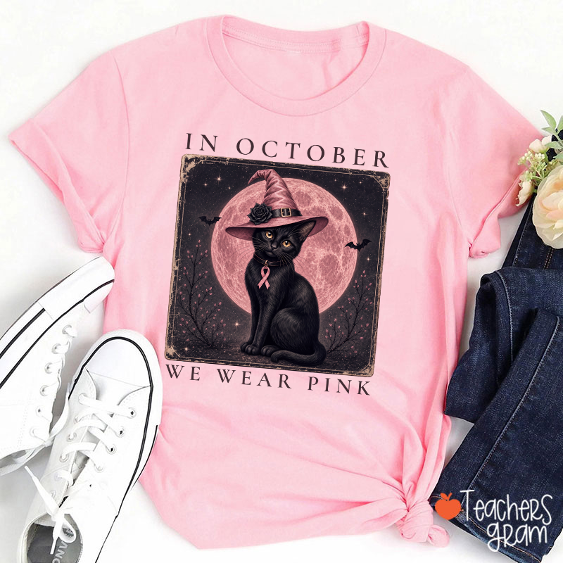 In October We Wear Pink Witch Black Cat Pink Moon Breast Cancer Awareness Teacher T‑Shirt