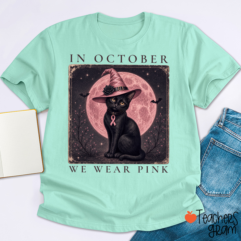 In October We Wear Pink Witch Black Cat Pink Moon Breast Cancer Awareness Teacher T‑Shirt