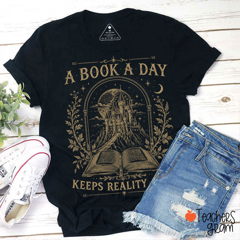A Book A Day Keeps Reality Away Magic Castle Open Book Teacher T‑Shirt