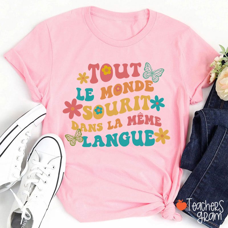 Tout Le Monde Sourit Dans La Même Langue French Teacher T-Shirt
