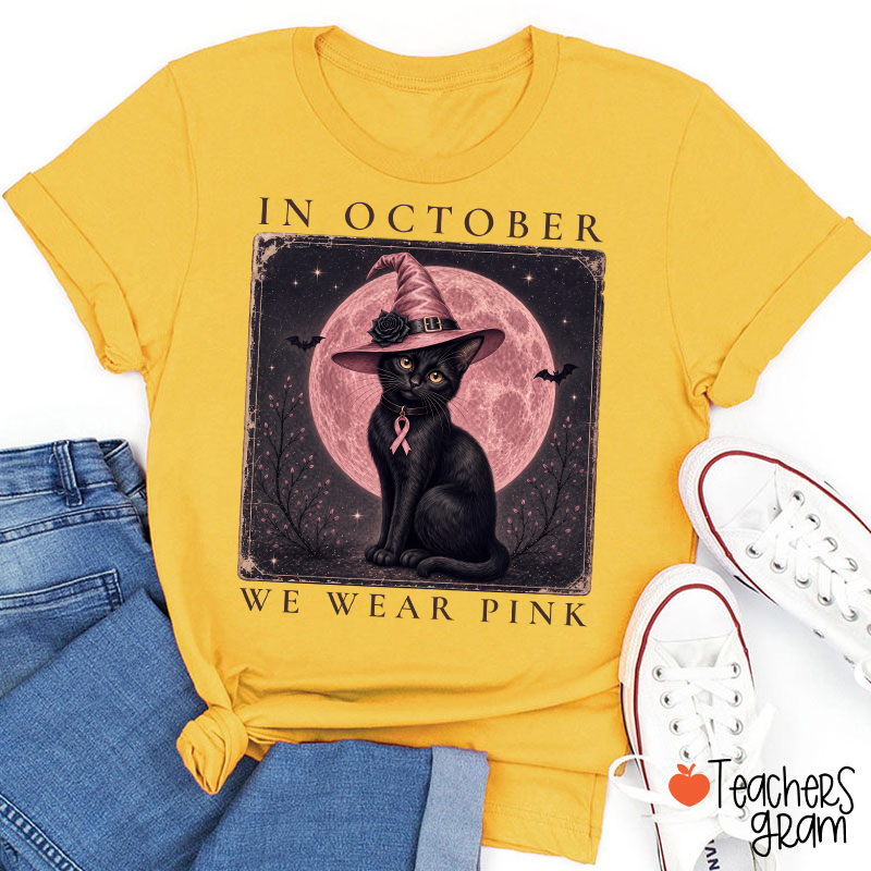 In October We Wear Pink Witch Black Cat Pink Moon Breast Cancer Awareness Teacher T‑Shirt