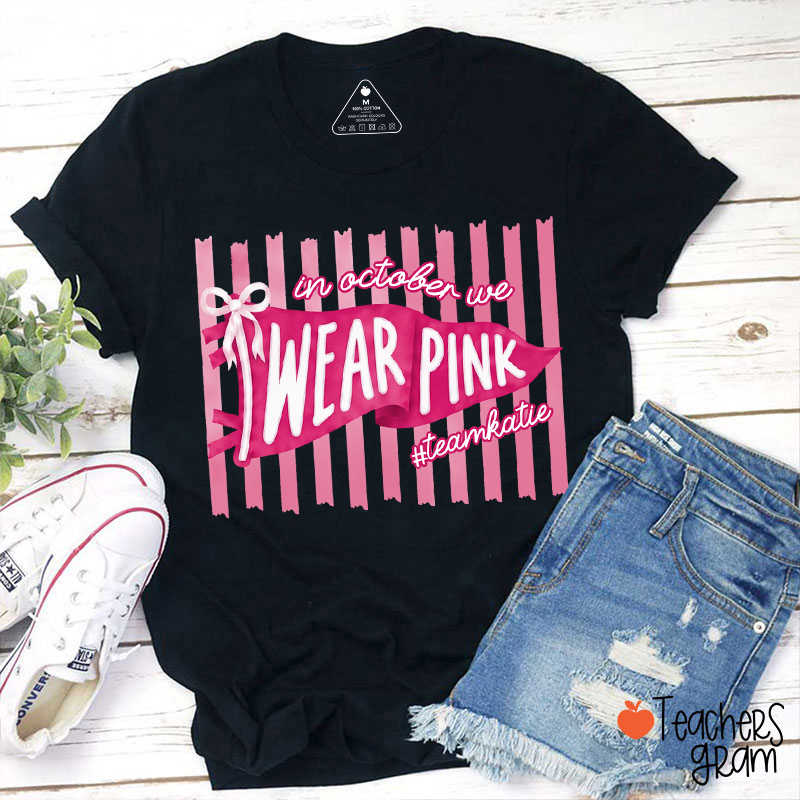 Personalized In October We Wear Pink Pink Stripe Flag Bow Teacher T-Shirt-Teachersgram