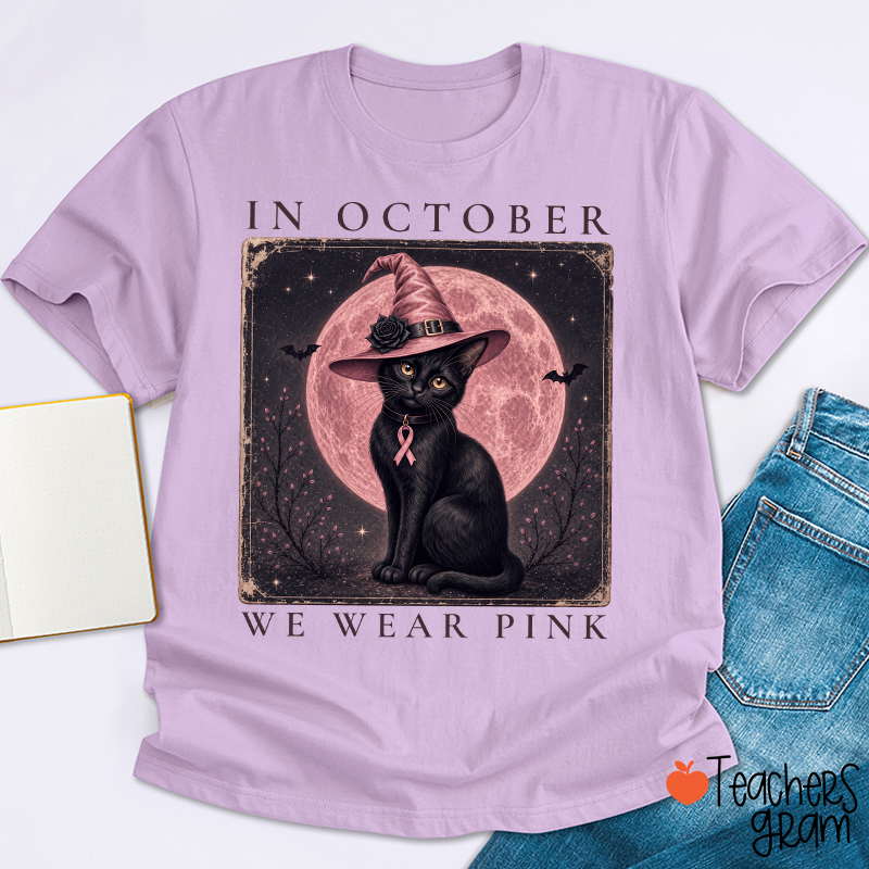 In October We Wear Pink Witch Black Cat Pink Moon Breast Cancer Awareness Teacher T‑Shirt