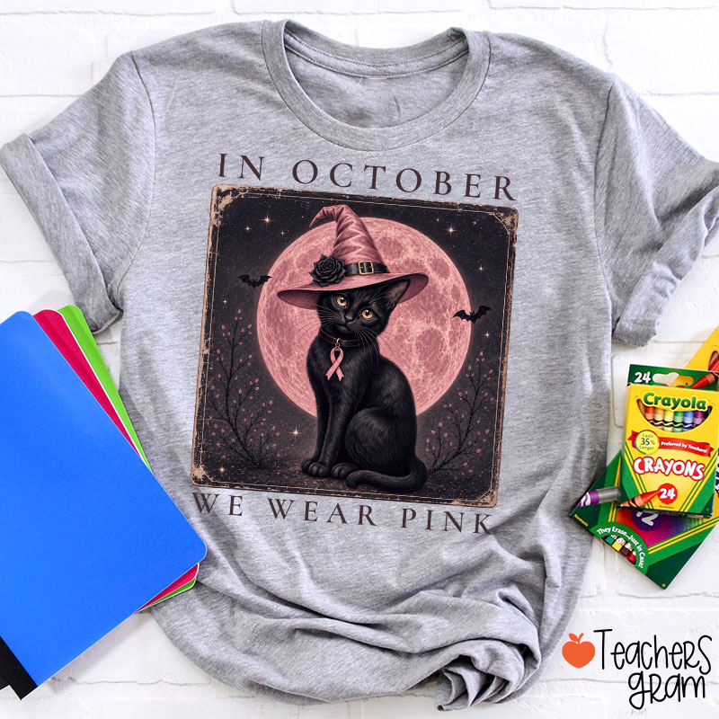 In October We Wear Pink Witch Black Cat Pink Moon Breast Cancer Awareness Teacher T‑Shirt