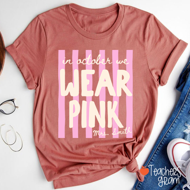 Personalized Name In October We Wear Pink Striped Teacher T-Shirt