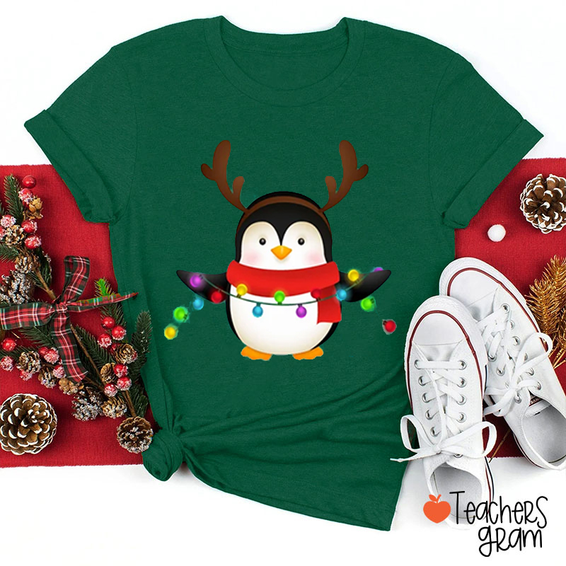 Penguin With Reindeer Horns And Christmas Lights Teacher T-Shirt