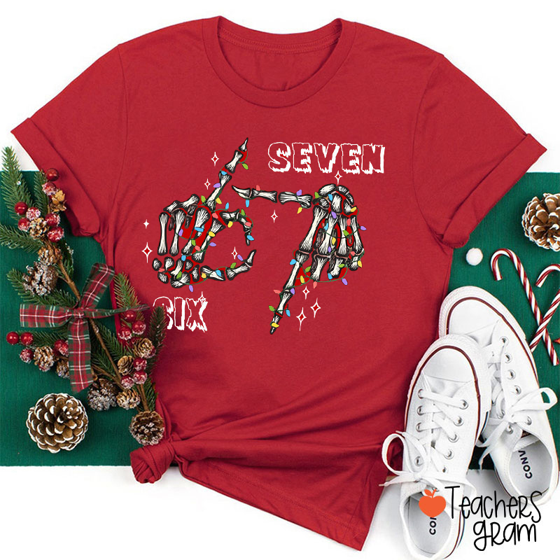 Six Seven Christmas Lights Skeleton Hand Teacher T-Shirt