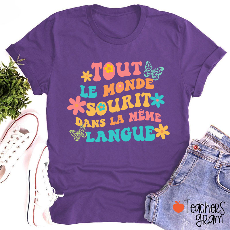 Tout Le Monde Sourit Dans La Même Langue French Teacher T-Shirt